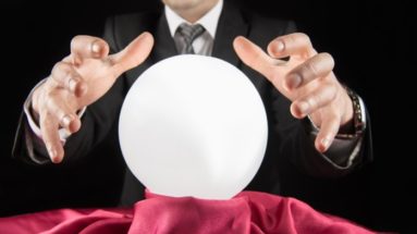 A business person over a crystal ball