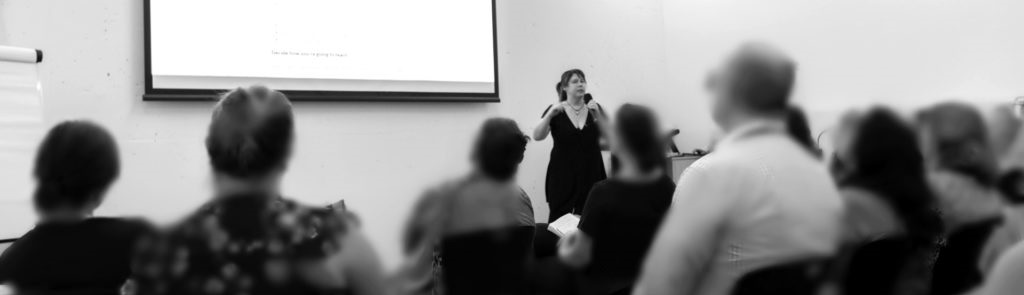 Kylee Bristow conducting training and the front-row attendees